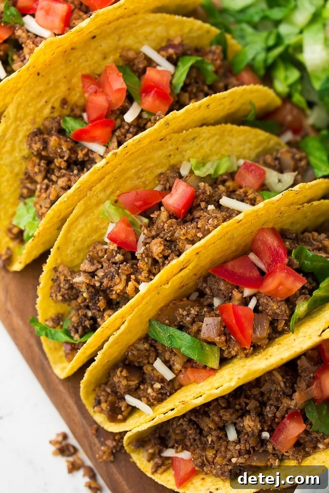 The Ultimate Vegan Taco Filling 2 looking down and to the side at tacos lined up