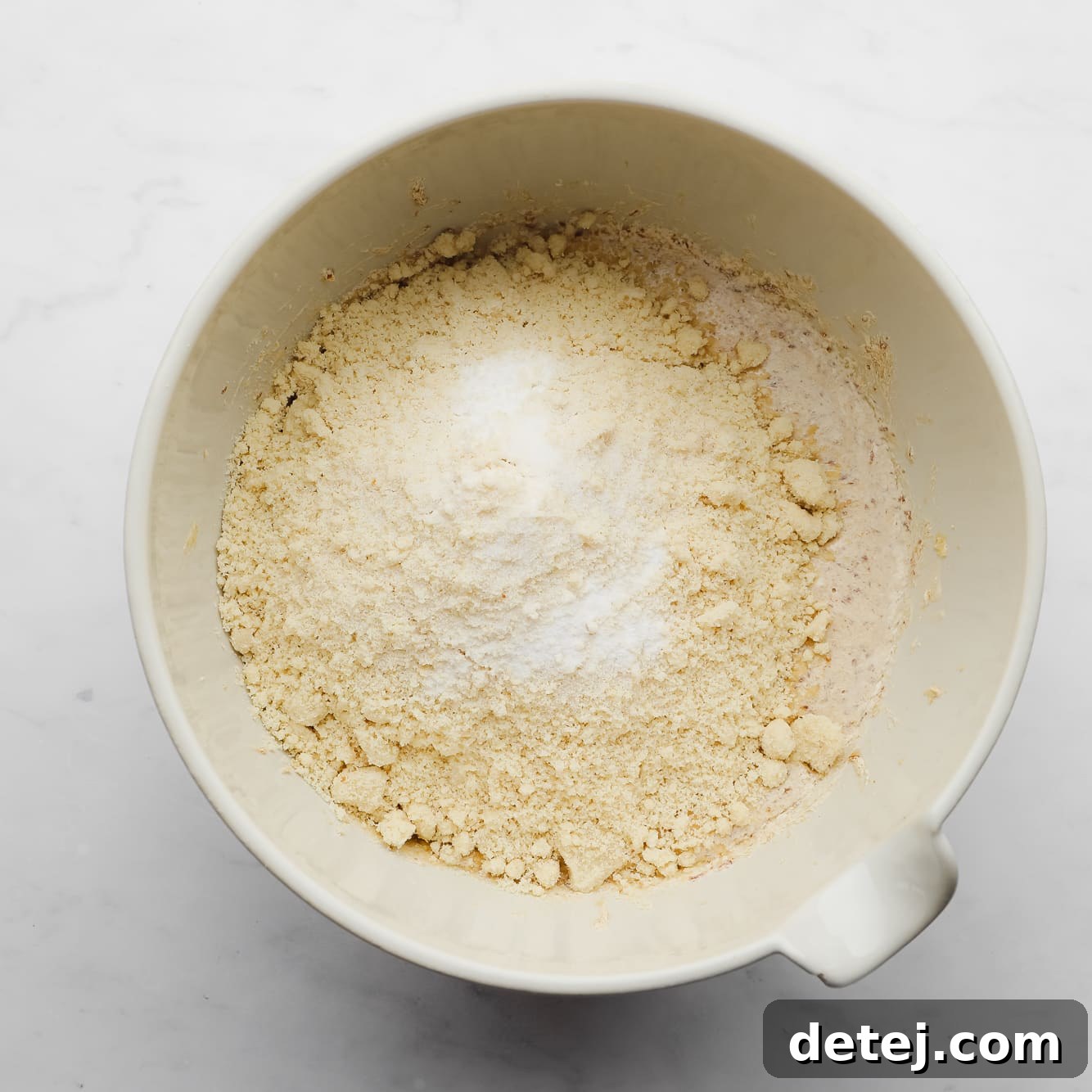 dry ingredients for almond flour cookies in a large white bowl.