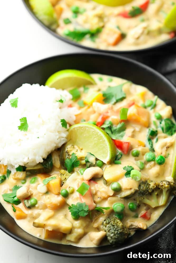 Vibrant Vegan Thai Green Curry 3 black bowl with white rice, creamy curry and limes