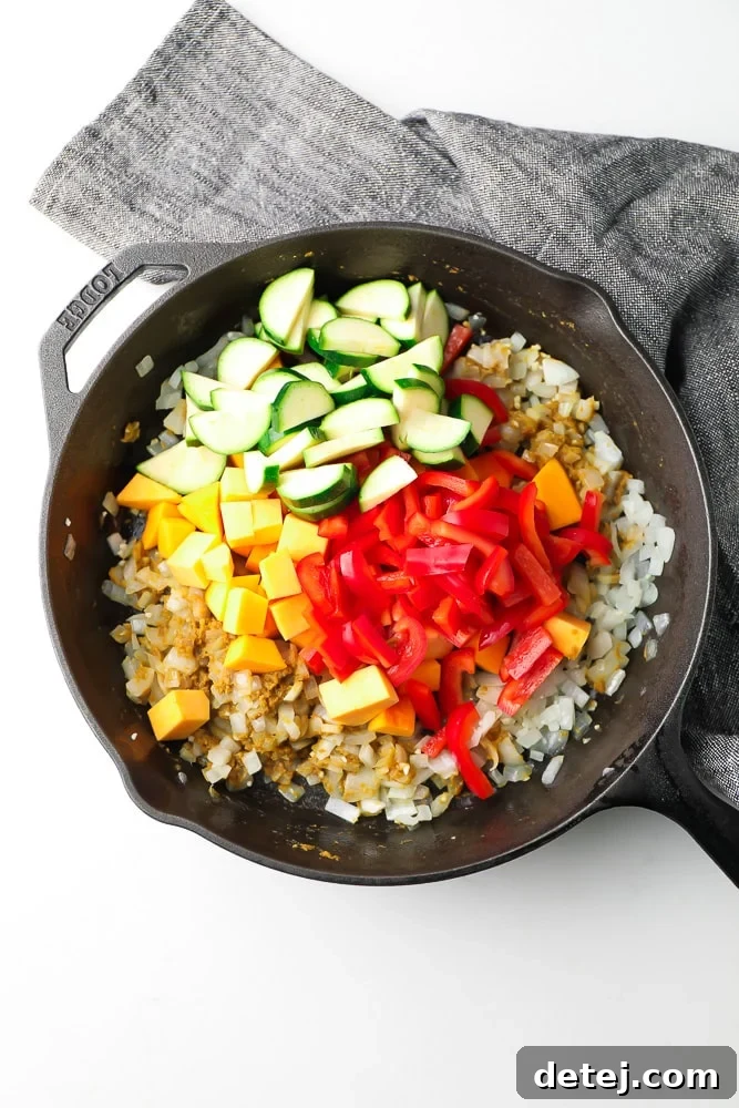 Vibrant Vegan Thai Green Curry 4 cast iron pan with vegetables in it