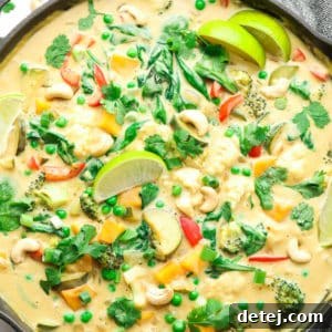 Vibrant Vegan Thai Green Curry 9 square image on a pan with creamy curry and limes