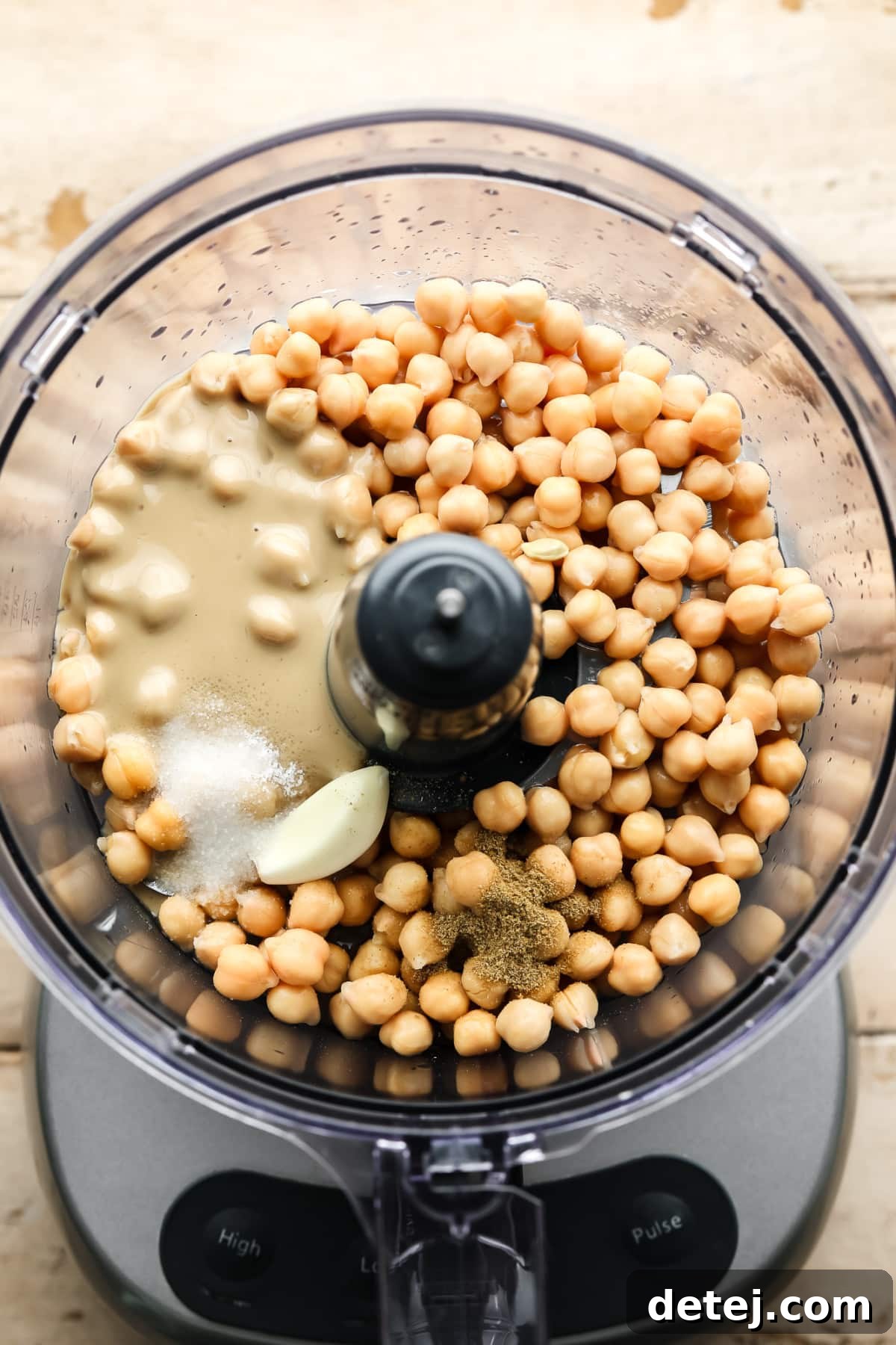 Ingredients for hummus in a food processor.