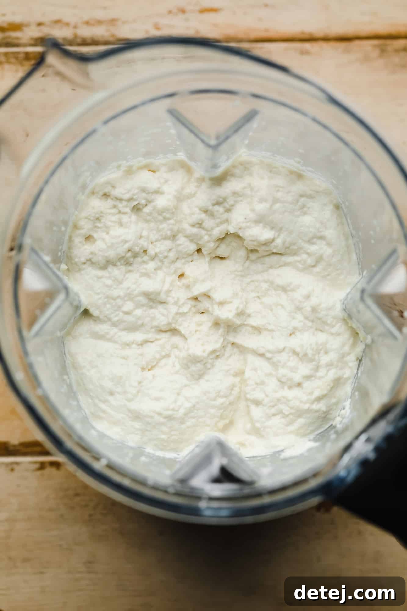 Blended vegan ricotta cheese in a blender.