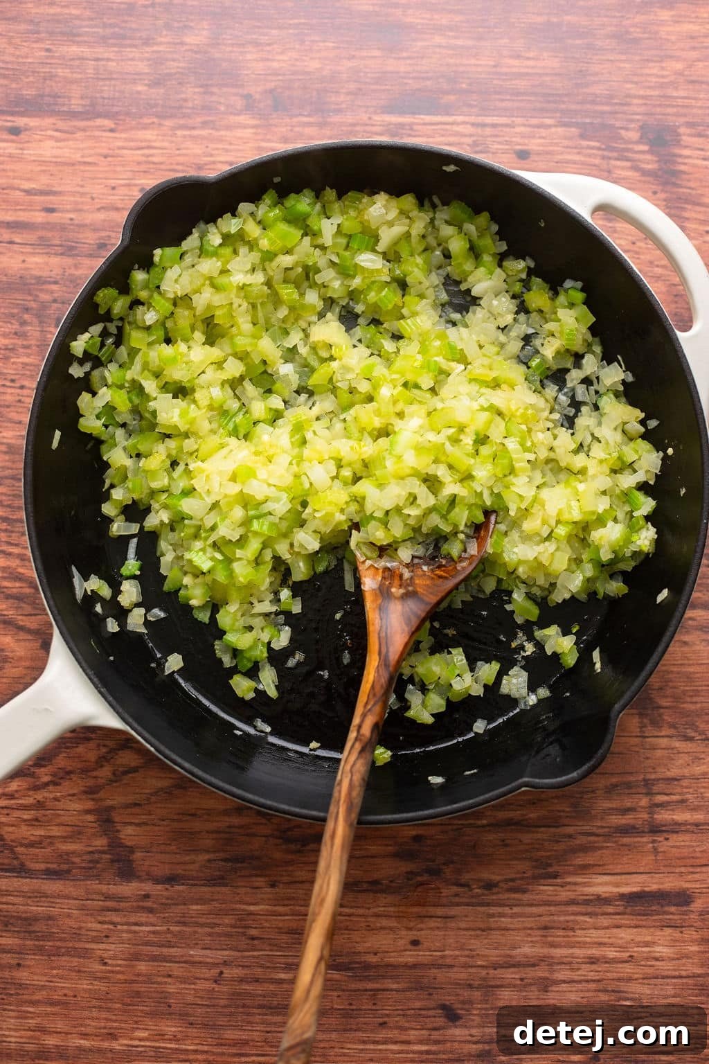 Ultimate Vegan Stuffing 6 Diced celery and onions cooking in a large skillet, softened and translucent.