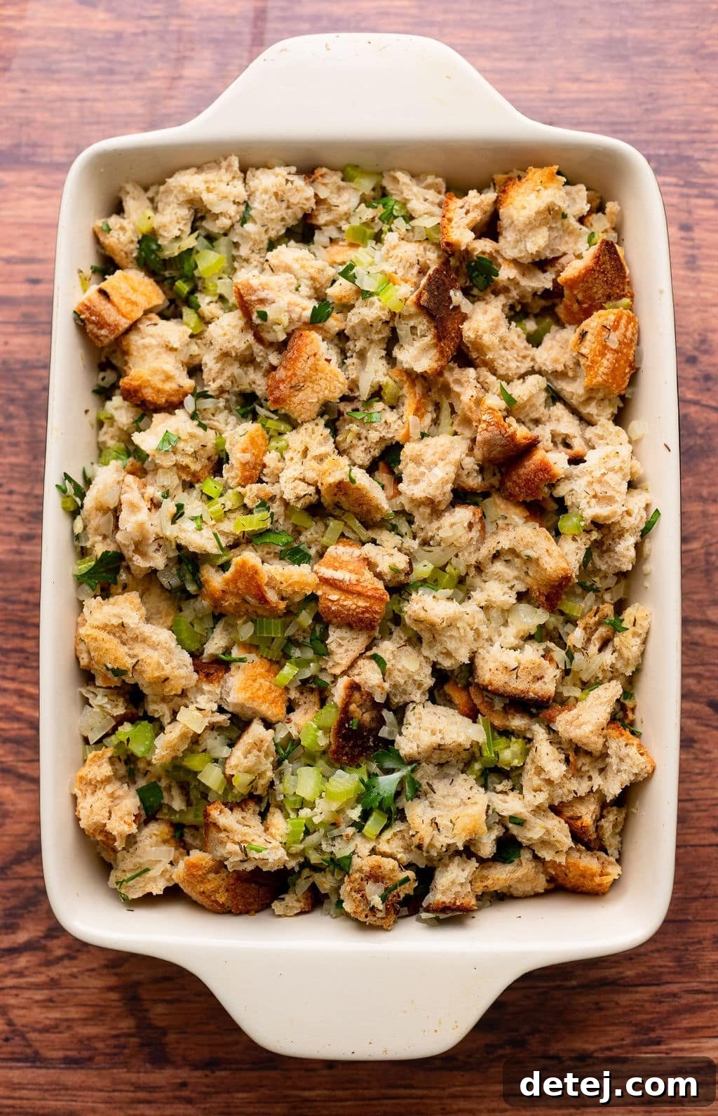 Ultimate Vegan Stuffing 9 Unbaked vegan stuffing mixture evenly spread in a baking dish before going into the oven.