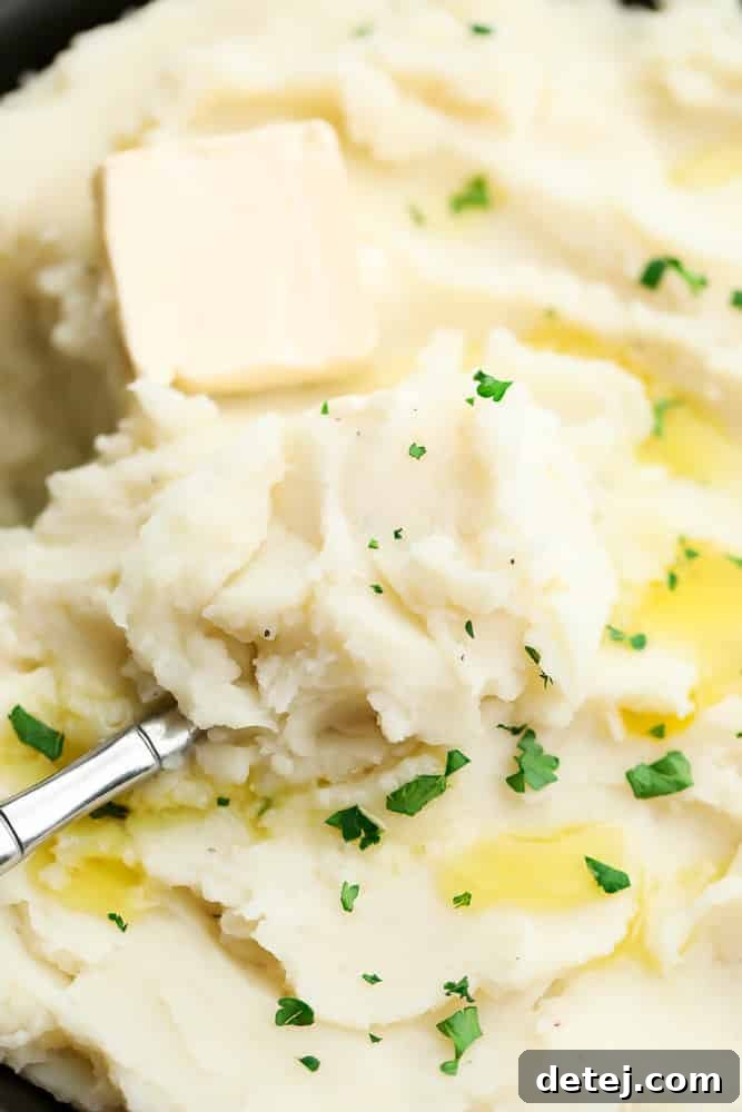 spoon in bowl of potatoes