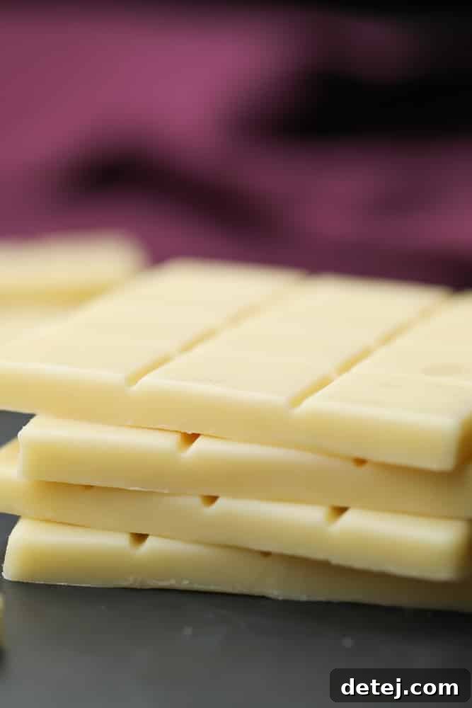 Stack of smooth, rectangular vegan white chocolate bars, ready to be enjoyed or used in recipes.