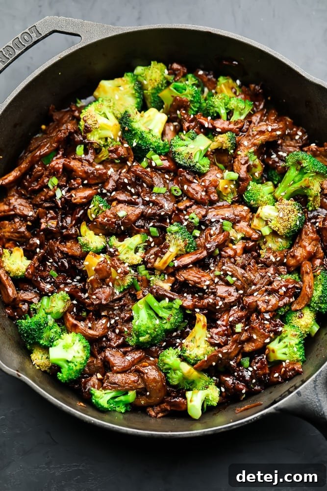 Delicious vegan beef and broccoli stir fry in a cast iron pan, ready to serve