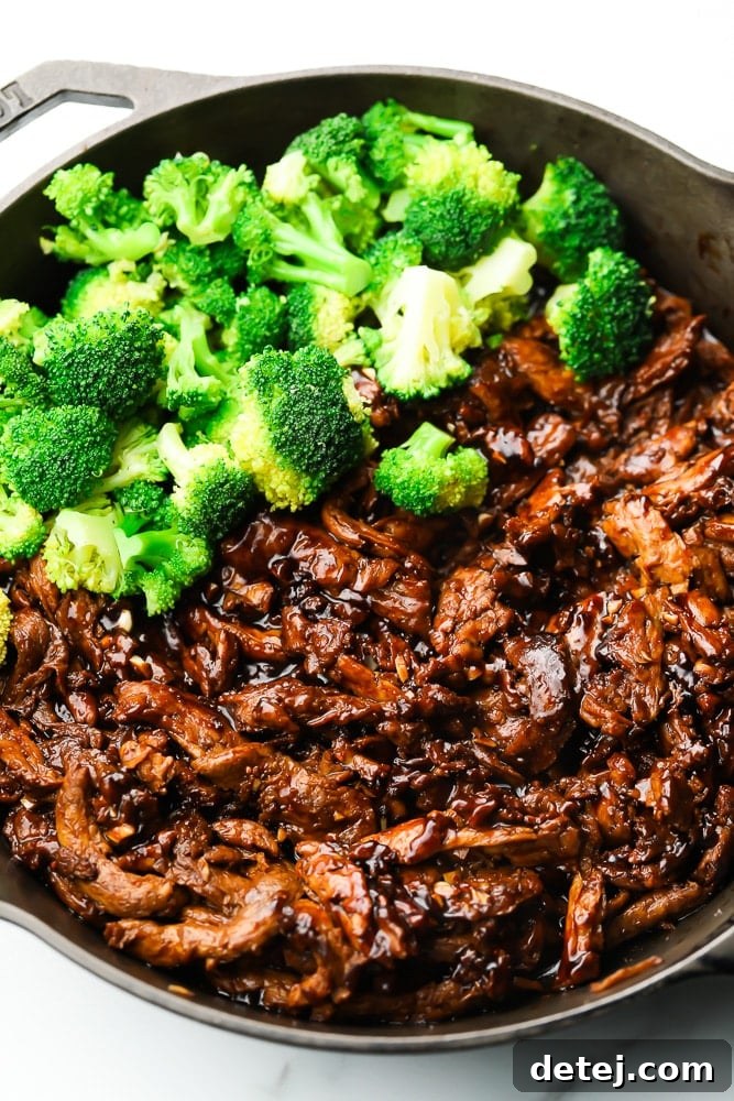 Close-up of vegan beef and vibrant green broccoli in a large pan