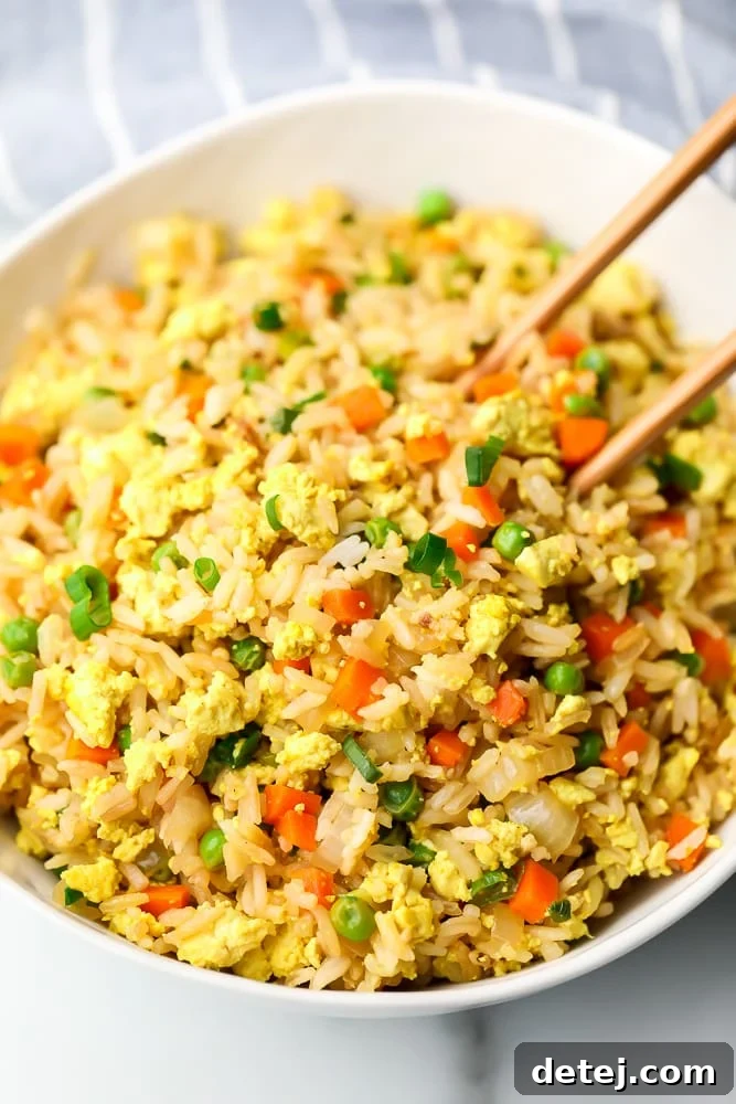 close up of a bowl of rice with chopsticks