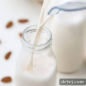 square image of milk pouring into glass