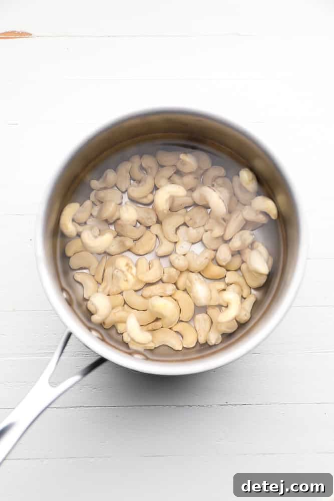 cashews being soaked in a small pot