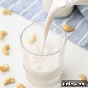 square image of a glass of milk being poured into a cup