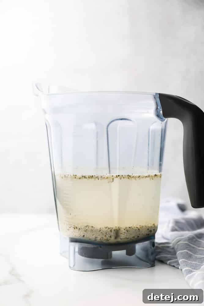Blender filled with hemp seeds and water, before blending into a smooth milk