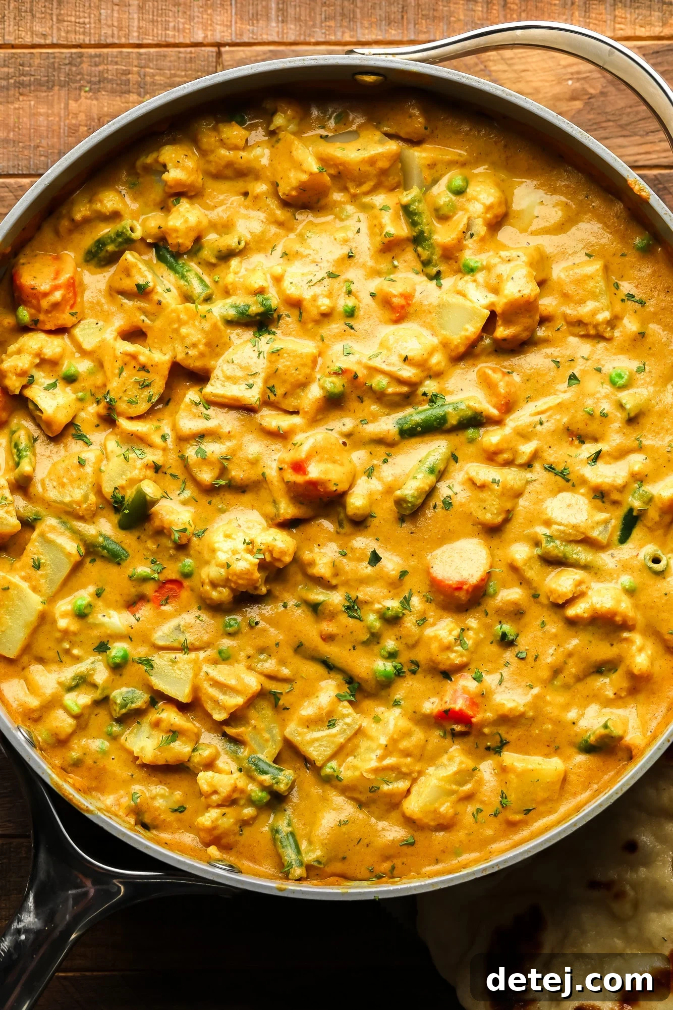 a large pot of golden vegetable korma.