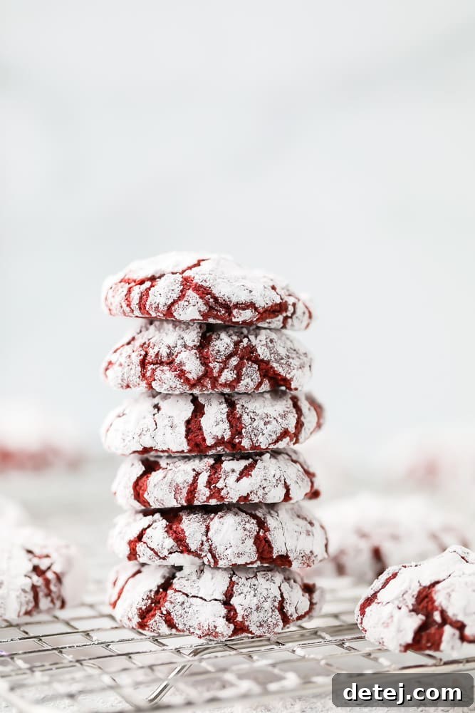 Decadent Red Velvet Crinkle Delights 4 Stacked vegan red velvet crinkle cookies, showing their soft texture and appealing color.