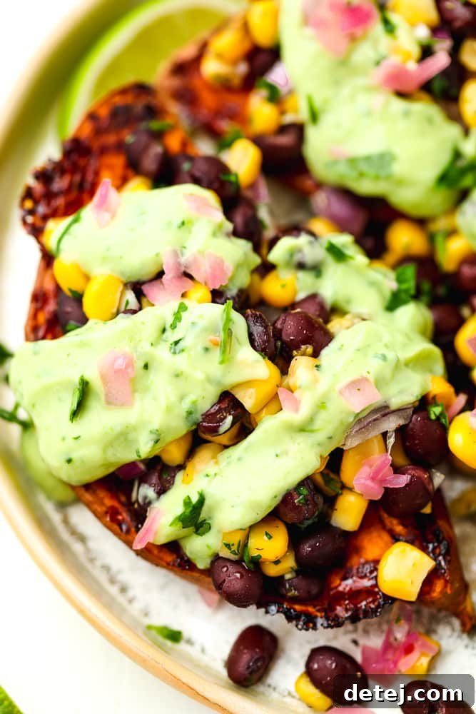 close up of a halved sweet potato stuffed with mexican fillings