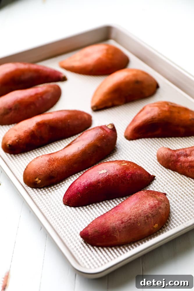 halved sweet potatoes on a baking sheet