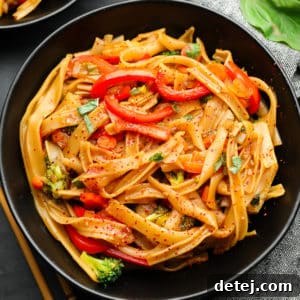 square photo of a bowl of noodles and veggies