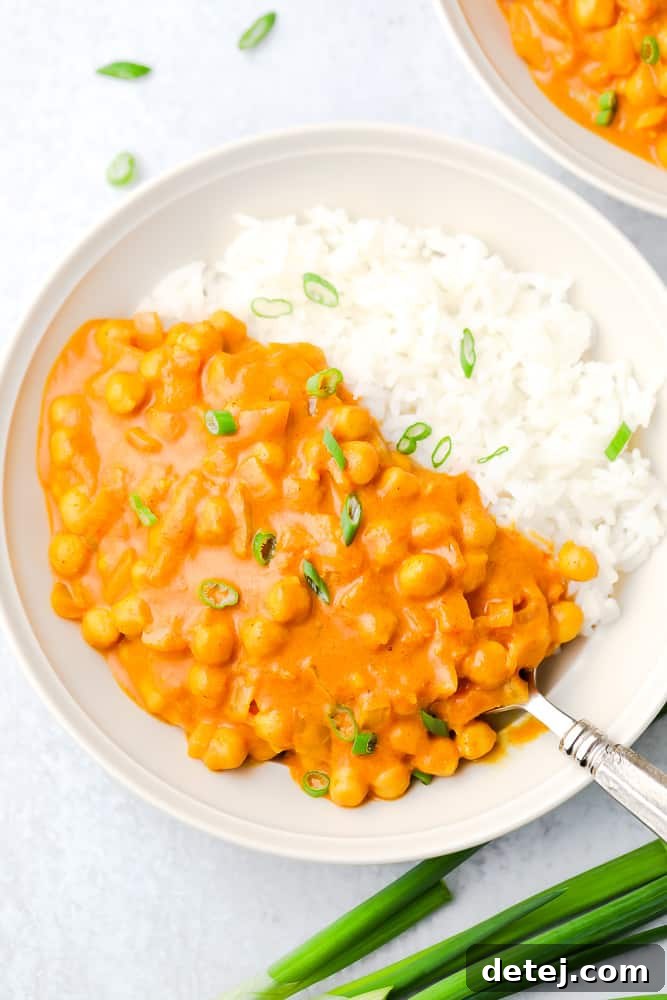 white bowl with bean tikka masala and white rice