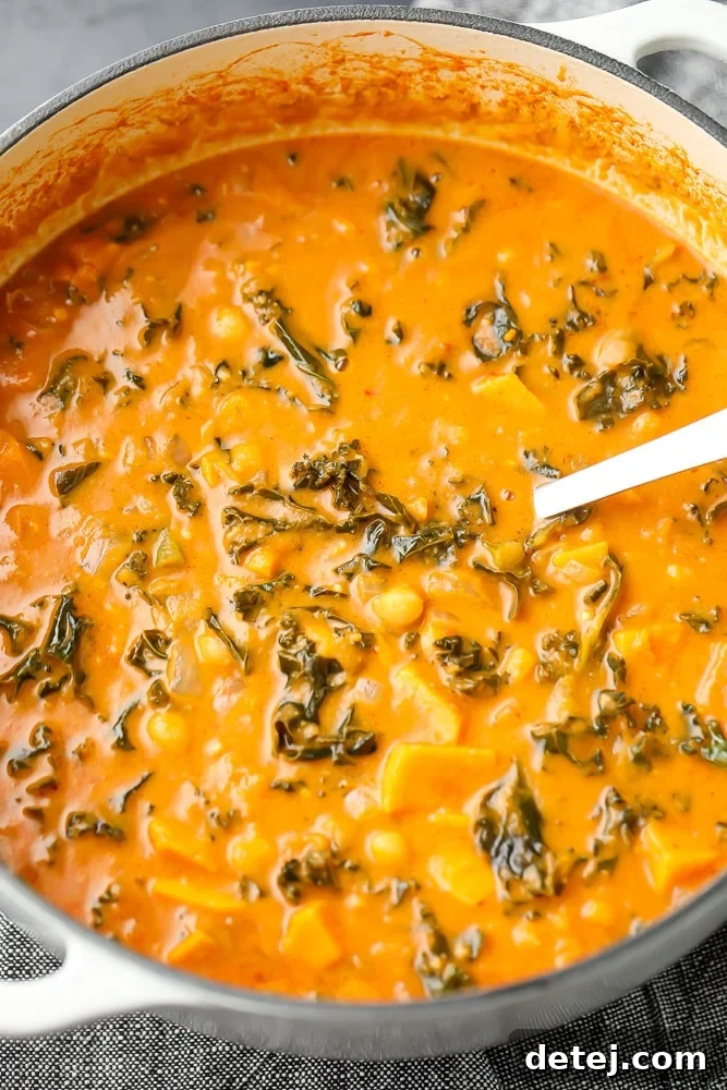large soup pot filled with orange soup