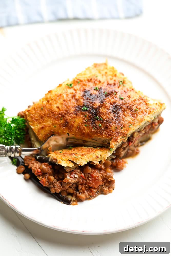 slice of moussaka on a white plate