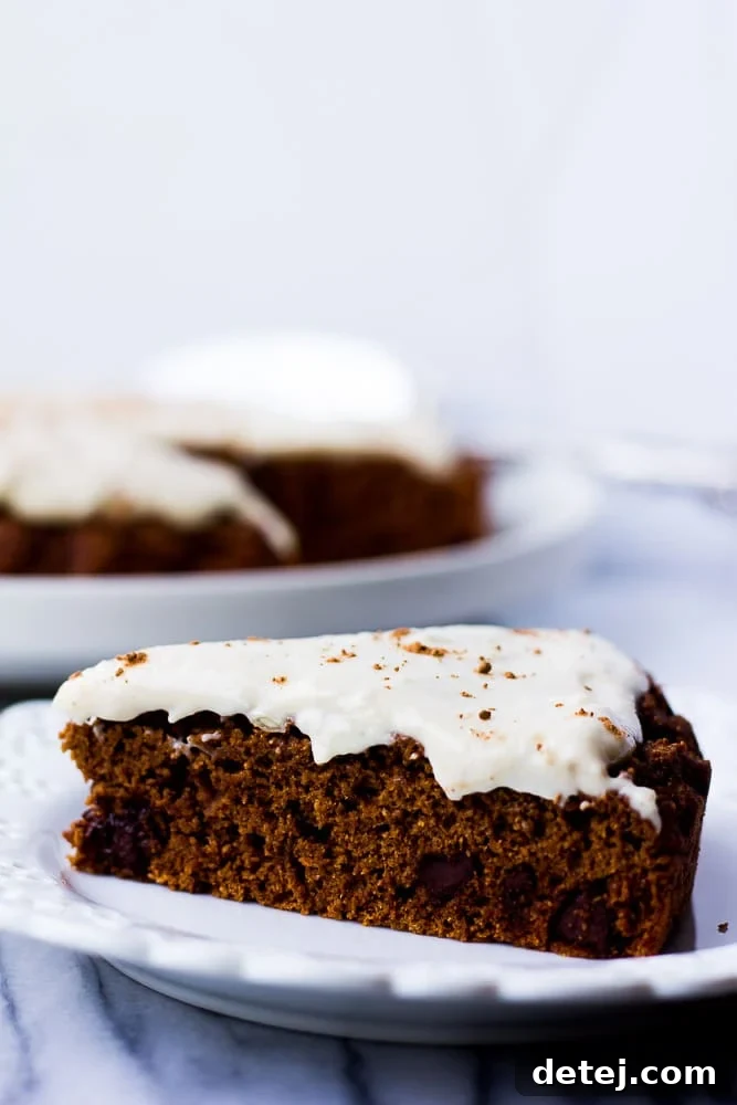 Slice of Oil-Free Chocolate Cake with Cashew Frosting, rich and decadent