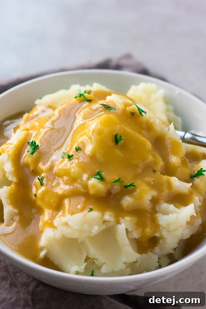 close-up shot of easy vegan gravy over mashed potatoes