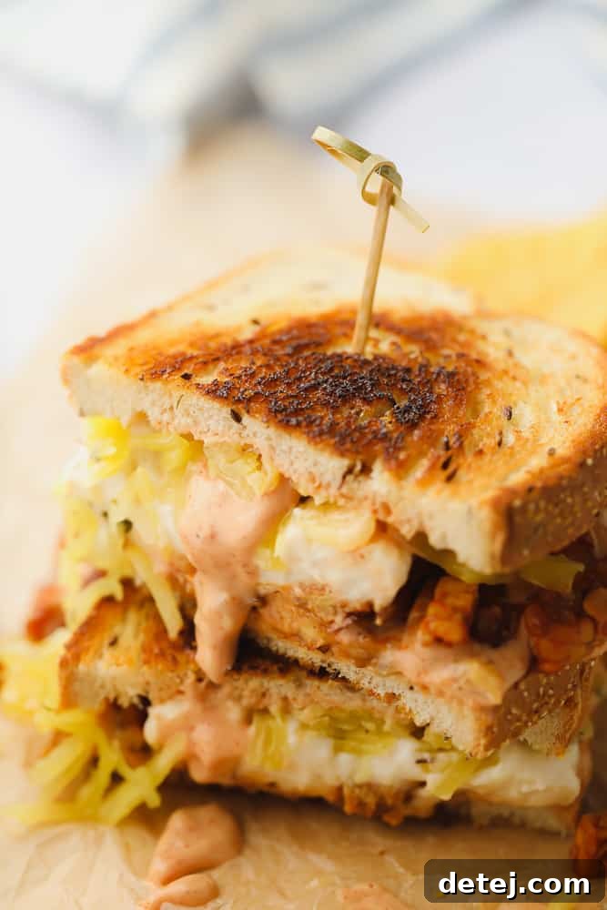 2 halfs of a vegan reuben sandwich on top of each other
