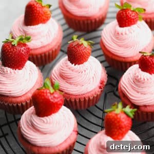 Square image of many strawberry cupcakes