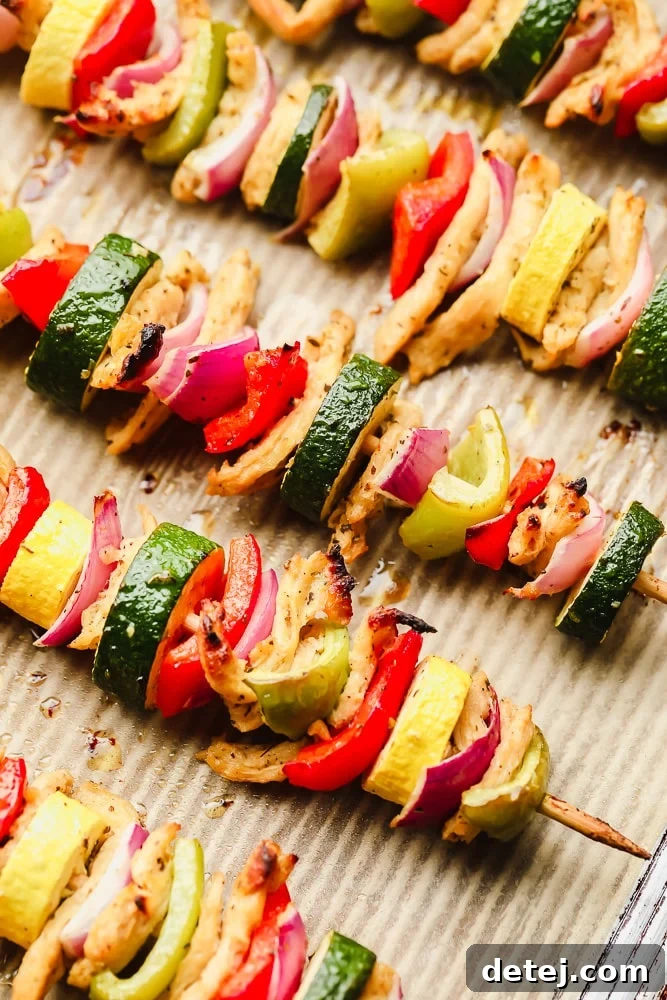 close up on cooked vegetable kebabs on a baking sheet