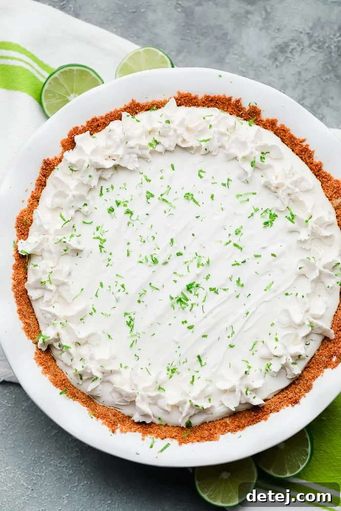 white key lime pie in a white pie plate