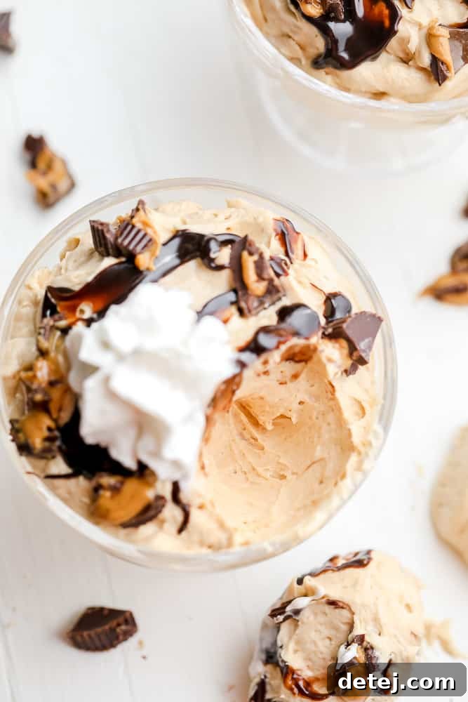scoop taken out out of a bowl of peanut butter mousse, showing its creamy texture