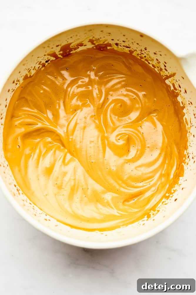 Cloud Coffee 6 A light brown whipped mixture in a large white bowl, showing its peak formation
