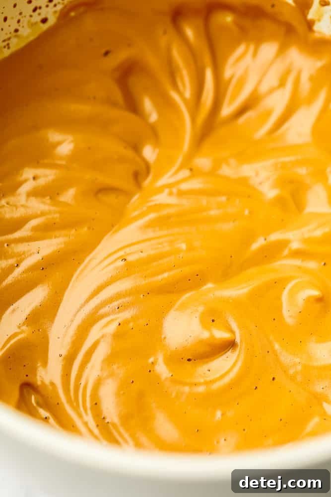 Cloud Coffee 7 Close up on golden brown whipped coffee in a bowl, showcasing its fluffy texture