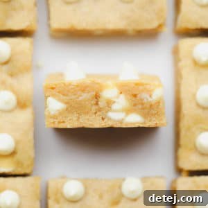 baked blondies with white chocolate chips cut into squares
