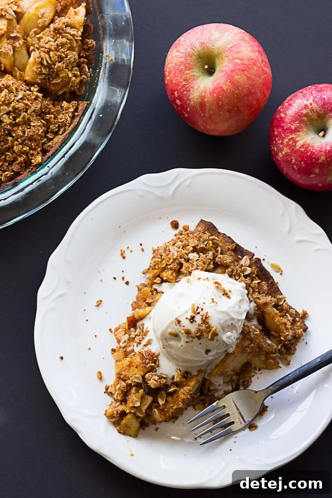 Gluten Free Vegan Apple Crumble Pie: Made with an almond flour crust, minimal oil, and full of sticky sweet apples with a perfect crumble topping.