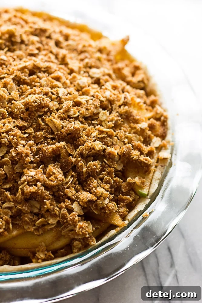 Gluten Free Vegan Apple Crumble Pie: Made with an almond flour crust, minimal oil, and full of sticky sweet apples with a perfect crumble topping.