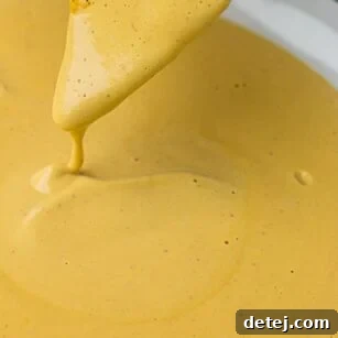 Easy Vegan Nacho Cheese Sauce: Made with cashews, this vegan nacho cheese sauce is a cinch to make, healthy and kid-friendly!