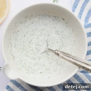 square image of shawarma sauce with blue towel in background