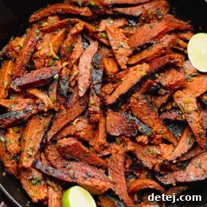 square image of carne asada made vegan in a black pan