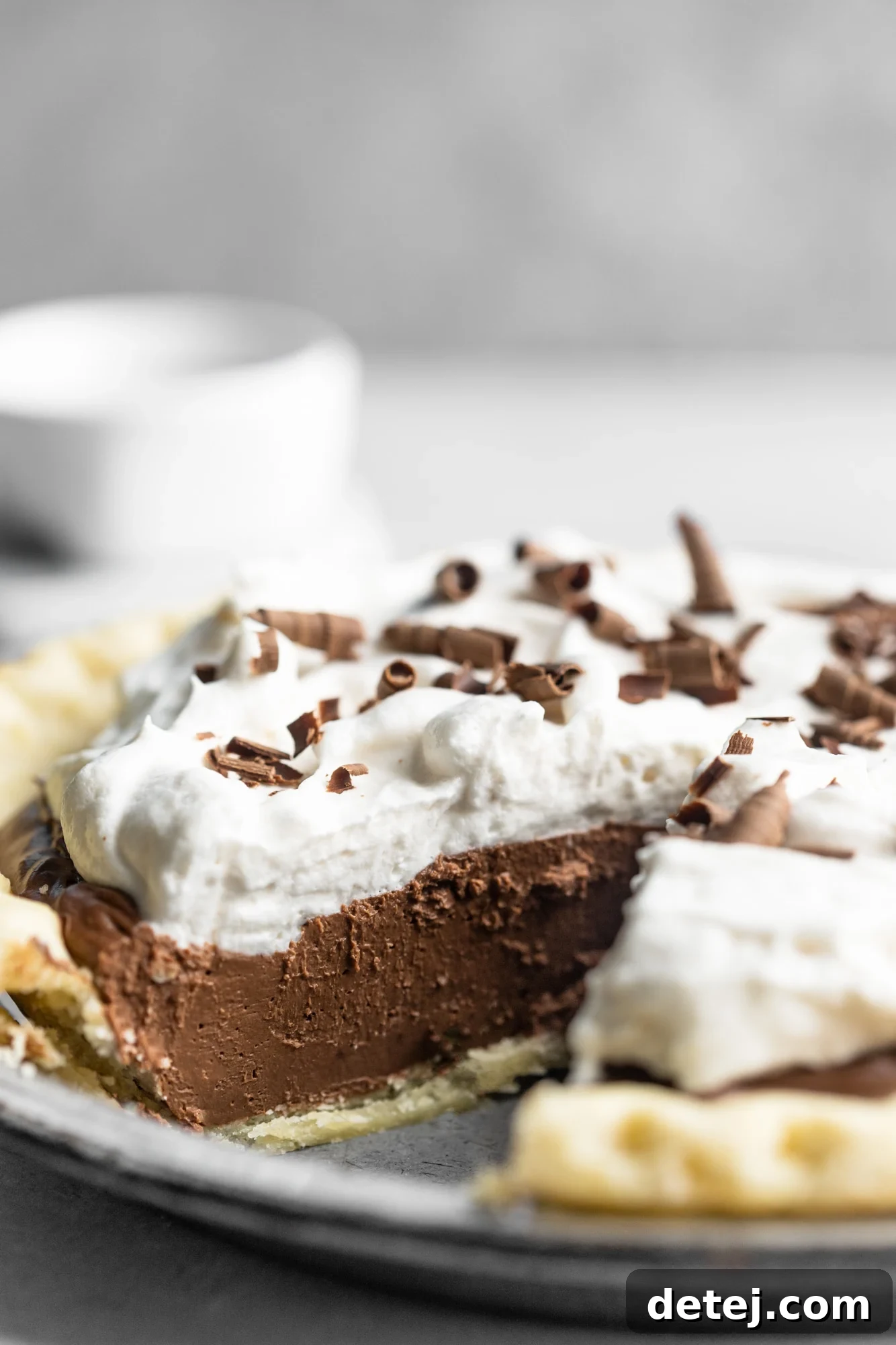 Velvet Vegan Chocolate Indulgence 2 side view of vegan chocolate pie with a slice removed.