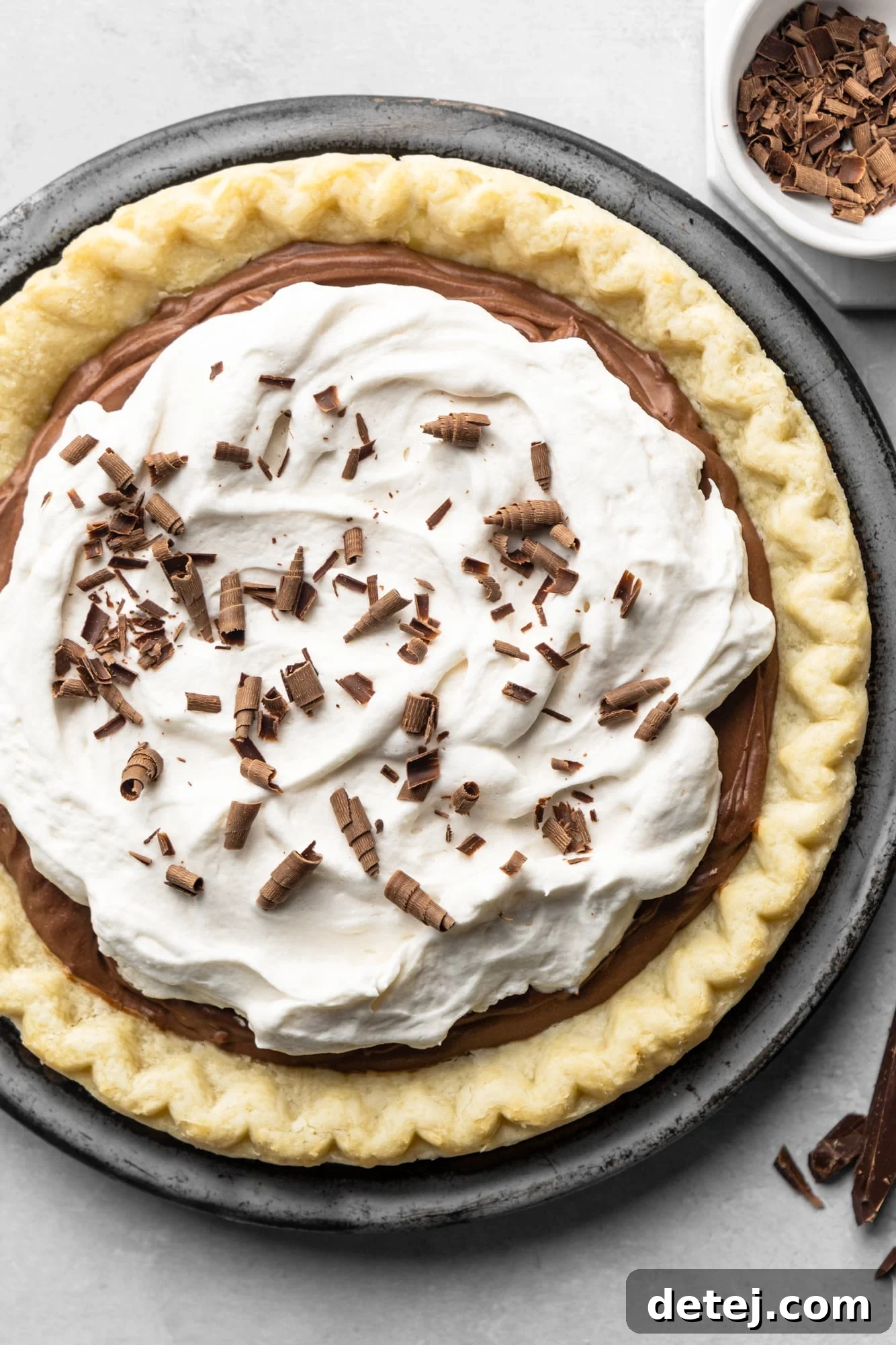 Velvet Vegan Chocolate Indulgence 8 vegan chocolate pie topped with whipped cream and chocolate shavings.