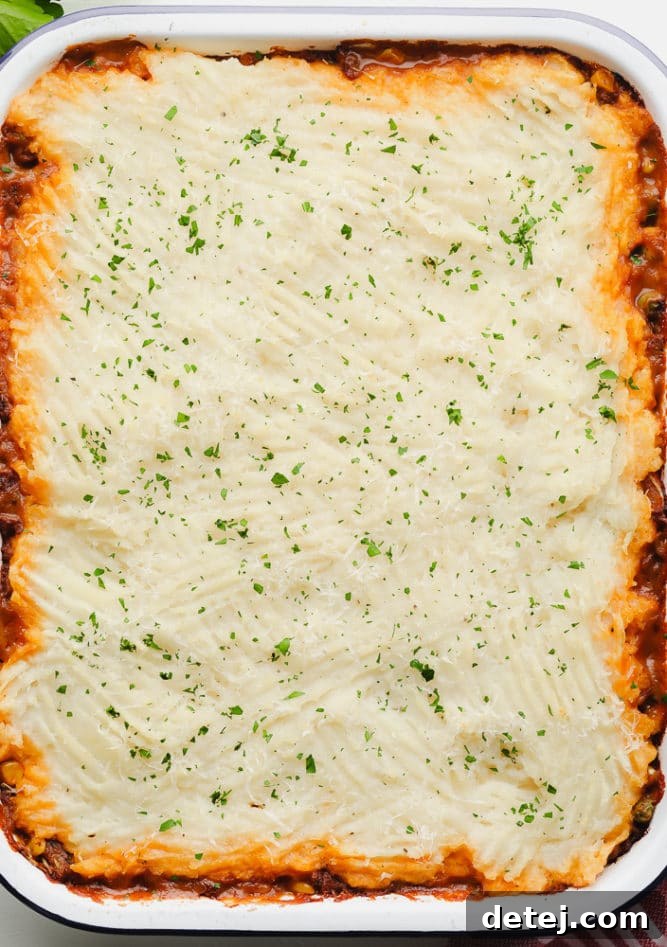whole uncut vegan shepherd's pie in a white pan