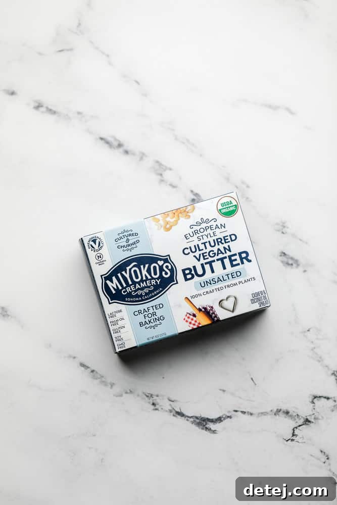 A package of Miyoko's European Style Cultured Vegan Butter resting on a sophisticated marble countertop.