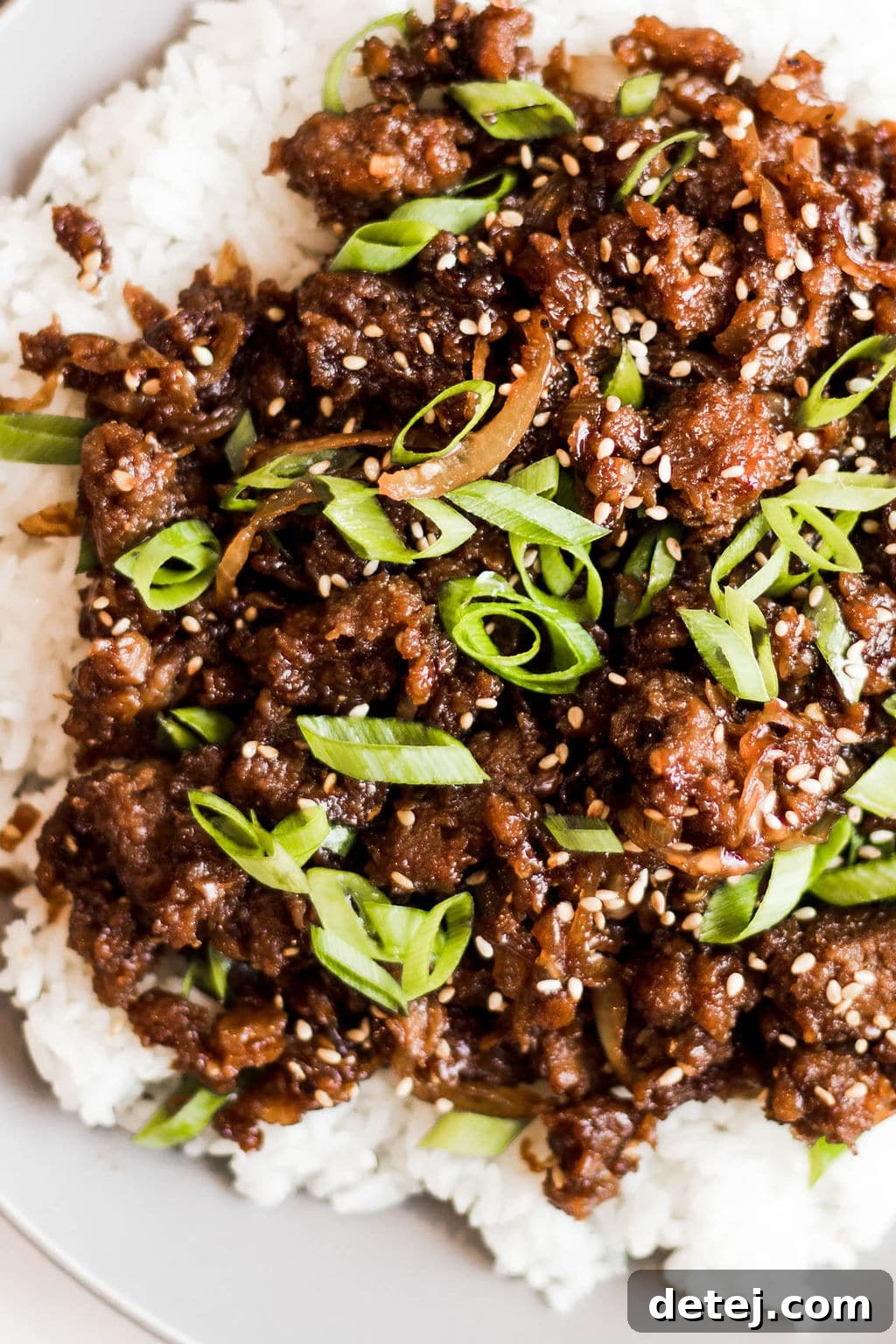 close up on cooked vegan ground beef on a pile of white rice.
