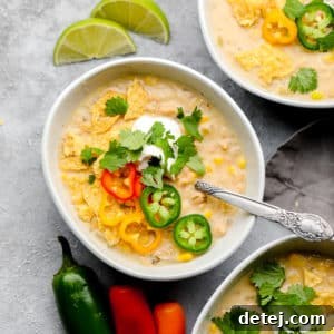 Square image of three bowls of white bean chili