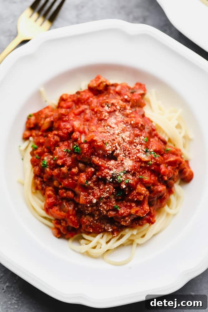 Ultimate Plant-Based Spaghetti 2 A bowl of spaghetti noodles generously topped with homemade vegan spaghetti sauce.