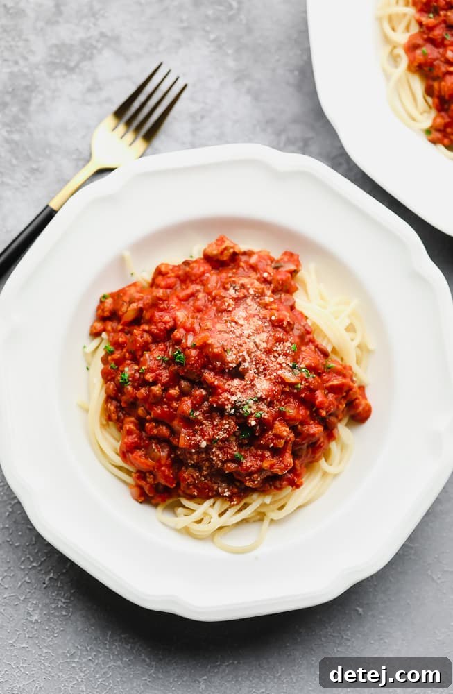 Ultimate Plant-Based Spaghetti 7 A beautifully presented bowl of spaghetti noodles with homemade vegan spaghetti sauce on top, ready to be enjoyed.