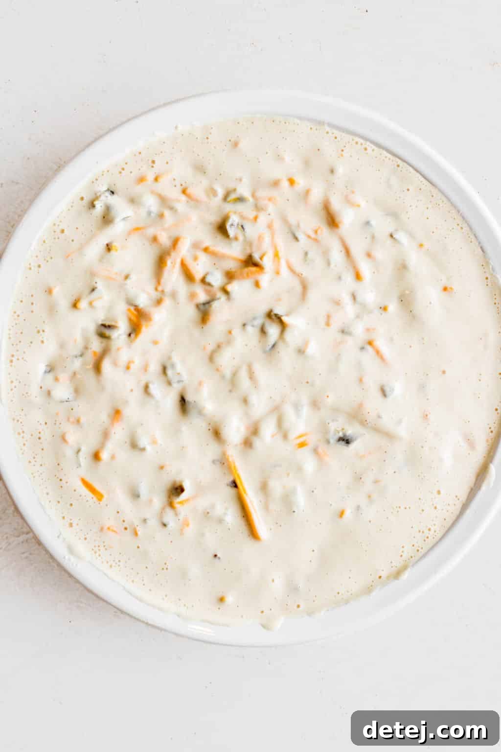 creamy white liquid in a white bowl.